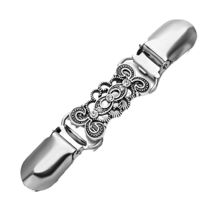 Vintage silver shawl clip with hollow floral pattern and sparkling rhinestones