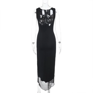 Detail view of backless cutout and mesh patchwork hem on this sexy black maxi dress