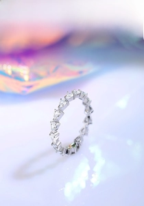 Detailed close-up of a S925 silver eternity ring featuring pear-cut cubic zirconia stones