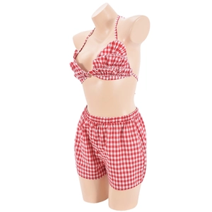 Detail of red and white plaid two-piece set with ruffled crop top and elastic shorts