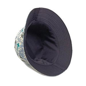 Detail view of double-sided reversible bucket hat with blue floral print and canvas texture