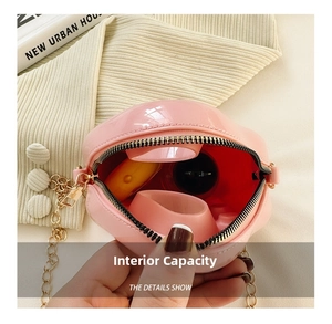 Internal capacity of pink round PVC mini bag showing space for lipstick and small items