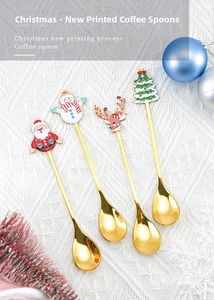 Detailed view of four golden stainless steel Christmas spoons with festive cartoon toppers