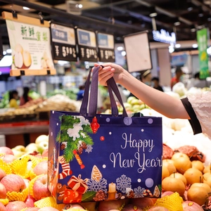 Christmas gift bag made of non-woven fabric with Happy New Year motifs in a supermarket