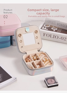 Close-up of portable iridescent jewelry box with built-in mirror and ring compartments