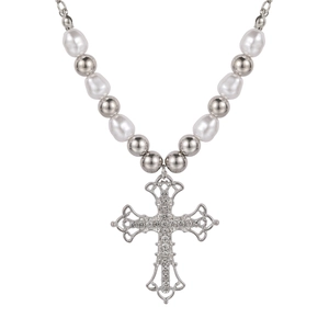 Vintage baroque pearl necklace with a large crystal encrusted cross pendant on white background