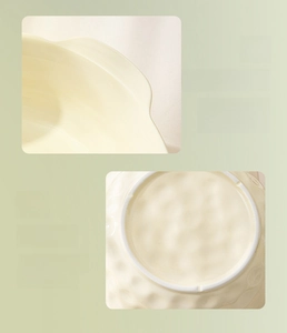 Detail view of double-handle ceramic bowl with wavy edge and non-slip unglazed bottom