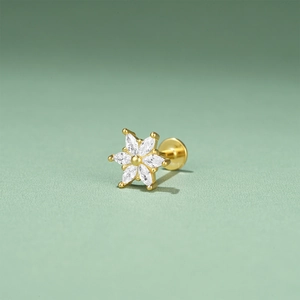 Detailed view of S925 silver golden flower ear stud with marquise-cut green zircon stones
