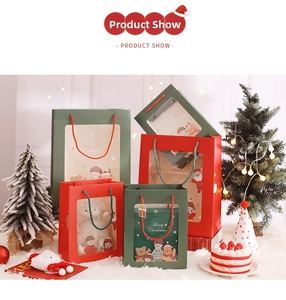 Christmas gift bags with festive cartoon prints and clear windows on white fur background