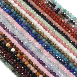 Macro view of faceted natural gemstone beads in multiple colors for DIY jewelry crafts