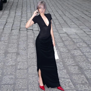 Detailed view of deep V-neck and high-slit hem on a slim-fit black summer maxi dress
