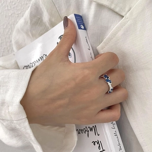 Irregular 925 sterling silver ring with oval blue gemstones in an elegant minimalist design