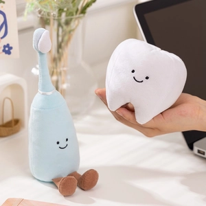 Creative plush toy set featuring a smiling white tooth and blue toothbrush characters