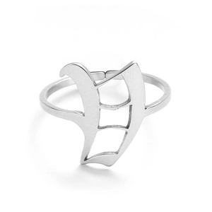 Macro view of a polished stainless steel ring featuring a vintage Gothic letter Y design