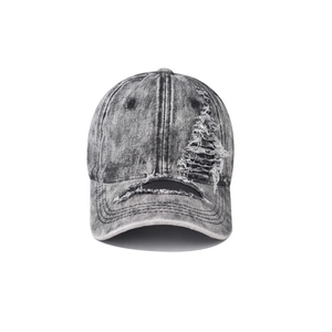 Close-up of distressed denim baseball cap with vintage washed texture and ripped details