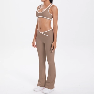 Detail view of khaki yoga set with contrast white trim and crossover high waist design