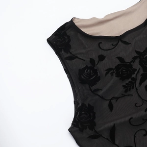 Detail of rose flocking on sheer black mesh fabric for elegant sleeveless dress