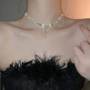 Collier en perles style palais français avec pendentif cœur cristal et franges dorées