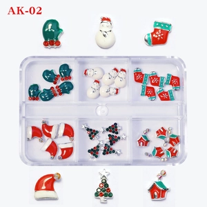 Macro view of Christmas nail charms in a storage box with snowmen and trees