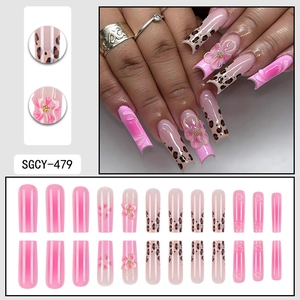 Elegant pink long coffin press-on nails with 3D floral accents and leopard print patterns