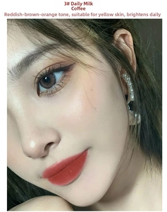 Close-up of velvet matte lip glaze in soft reddish-brown shade on model's lips