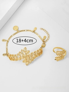 Detail of gold-plated leaf jewelry set featuring hollow texture and droplet charms