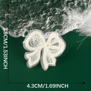 Detailed view of white lace bow patch with size measurements of 3.9cm by 4.3cm
