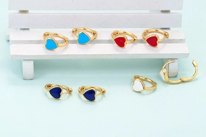 Colorful heart-shaped enamel hoop earrings in gold finish with multiple color options