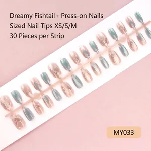 Detail view of Dreamy Fishtail press-on nails in pink and teal gradient, size XS-M
