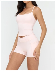 Close-up of pink yoga tank top with racerback design and elastic high-stretch fabric