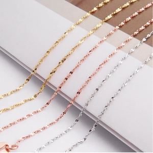 Detailed view of s925 silver water wave chains in gold, rose gold and silver finishes