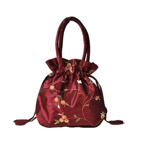 Vintage burgundy silk drawstring handbag with floral embroidery and satin finish
