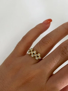 Close-up of 18k gold plated stainless steel ring with zircon stones on finger