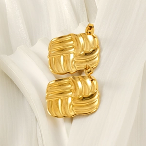 18k gold plated stainless steel square earrings with elegant woven texture on white fabric
