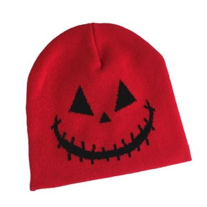 Red Halloween knit beanie with spooky pumpkin face embroidery for winter outdoor warmth