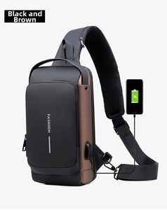 Close-up of the external USB charging port on this black and brown waterproof sling bag