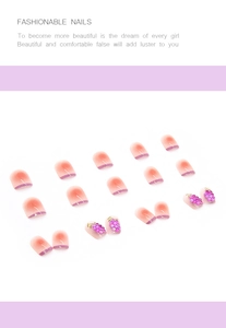 Detailed view of press-on nails with 3D grape motifs and purple French gradient finish