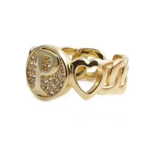 Close-up of gold plated ring with letter P design, heart detail and sparkling zircon