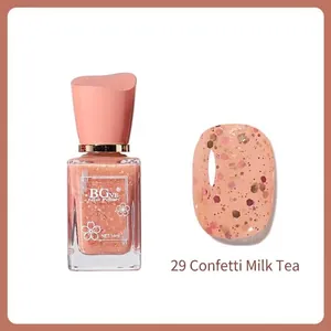 Detail of 14ml nail polish bottle and swatch in shade 29 Milk Tea with multi-color glitter