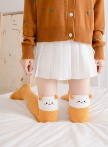 Detail of coral fleece over-knee socks with cute ginger bear embroidery and 3D ears