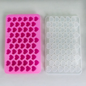 Detailed view of 55-cavity heart silicone molds in pink and translucent white for DIY crafts
