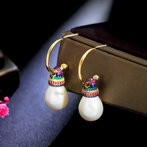 Detail of S925 rainbow zircon drop earrings with elegant white pearls on jewelry box