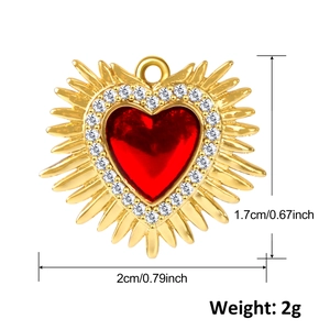 Detail view of heart pendant with ruby stone showing 1.7cm height and 2cm width dimensions