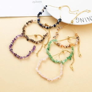 Detailed view of adjustable golden chain bracelets with multi-color natural raw crystals
