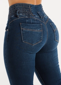 Detail showing high-waisted skinny jeans with elastic waistband and butt-lifting effect
