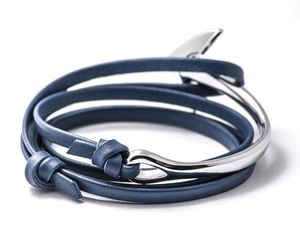 Macro shot of blue leather wrap bracelet with a polished silver anchor clasp detail