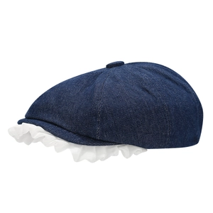 Navy blue denim beret with white lace ruffled brim and metallic button detail