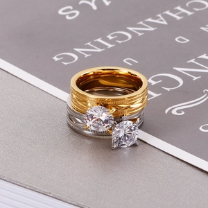 Elegant gold and silver titanium steel rings featuring large round-cut cubic zirconia