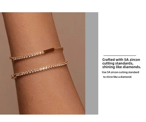 Close-up of gold chain bracelet featuring 5A grade cubic zirconia on a wrist