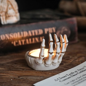 Gothic skull hand candle holder with vintage finish for Halloween home decor